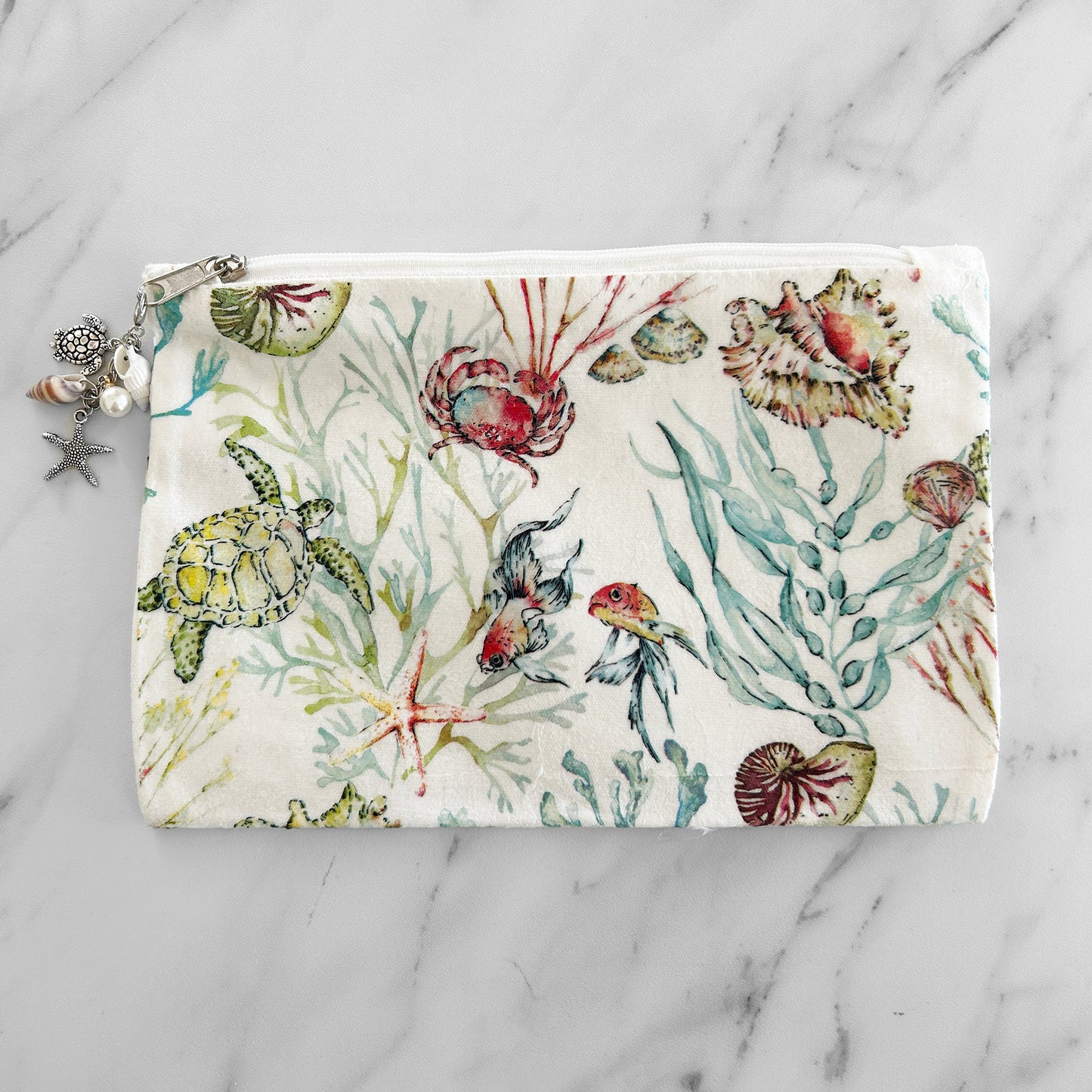 Canvas tote bag with a marine life theme, featuring a zipper and charm zipper.