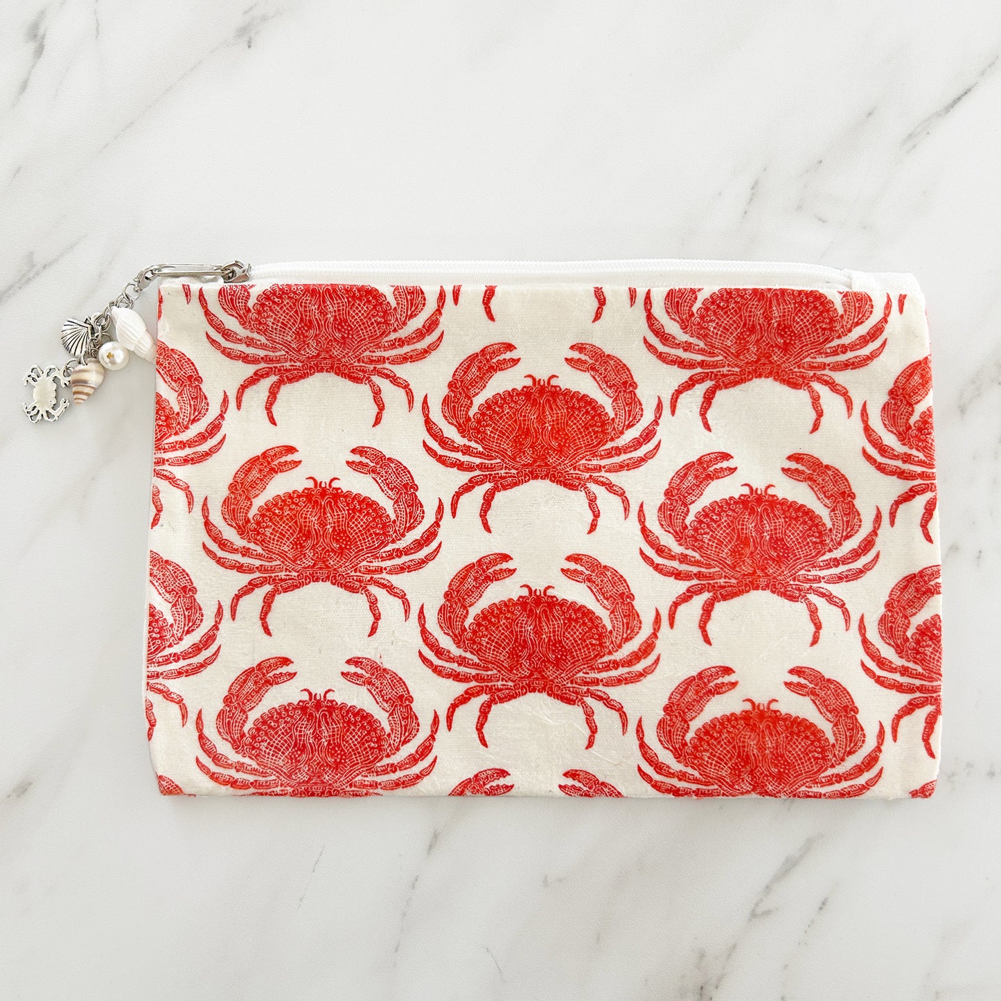 Canvas mini tote bag with red crab print and a zipper, featuring charms on the zipper.