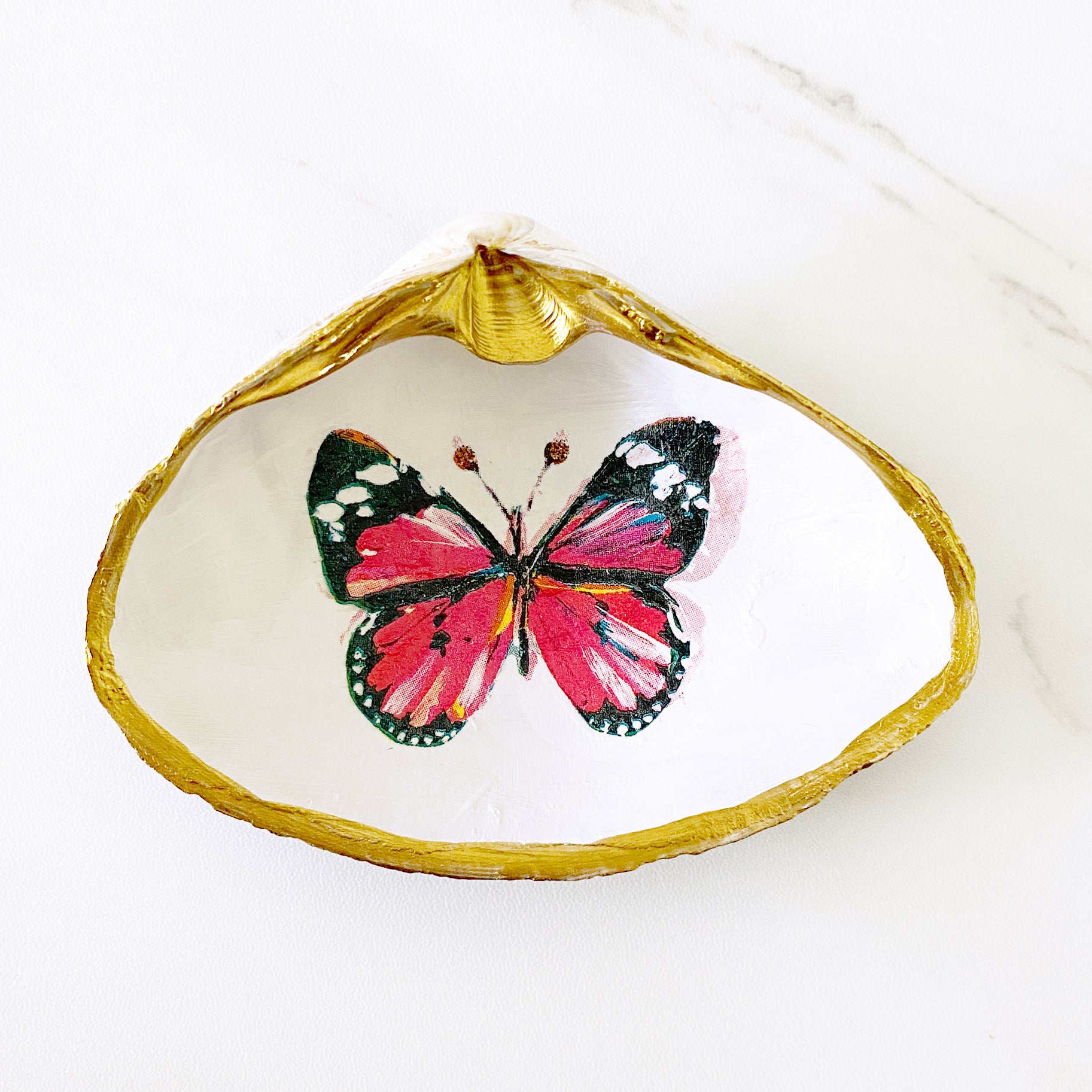 https://adoridesigns.com/cdn/shop/products/pink-butterfly-clamshell-ringdish1.jpg?v=1662756618&width=1825